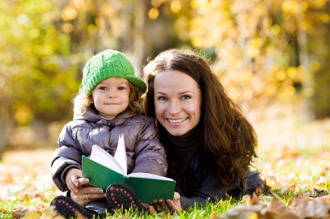 woman child kid patience reading happy family having fun in autumn park